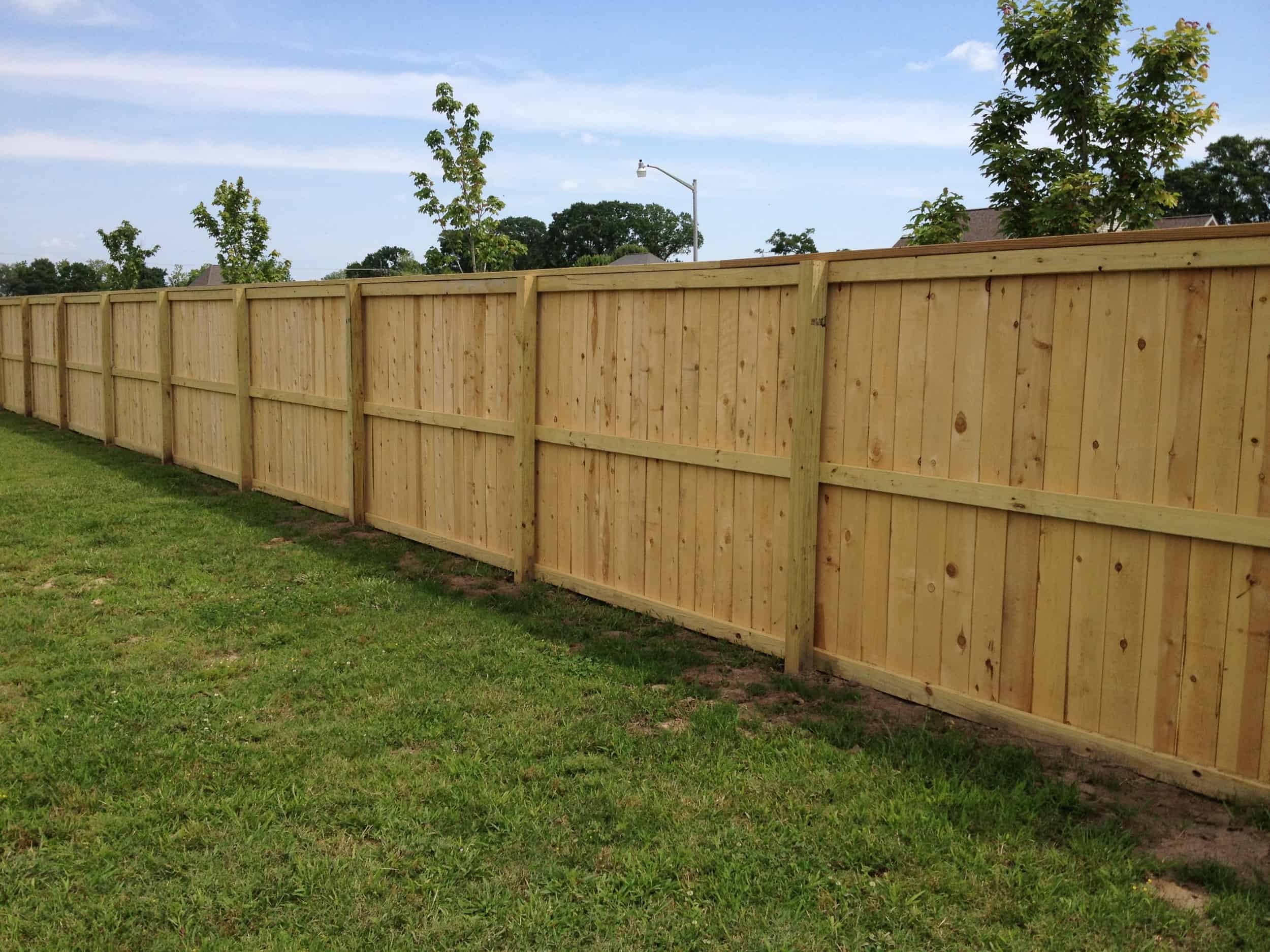 Classic wooden fence by Lakeland Fencing Pro, perfect for adding a natural and traditional look to properties.